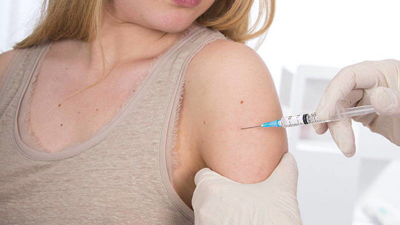 Click to enlarge girl getting injection