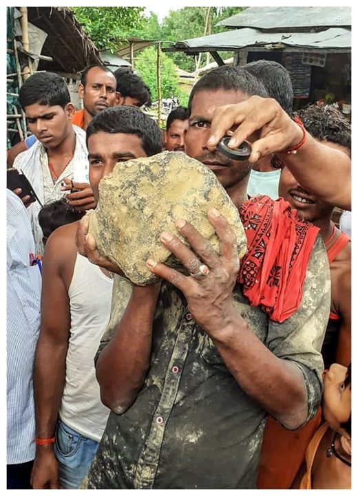 Click to enlarge Villager with Suspected meteorite