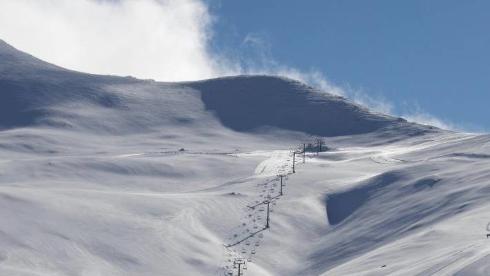 Click to enlarge Strong winds and snow drifts forced Mt Dobson skifield to close its access road on Thursday.