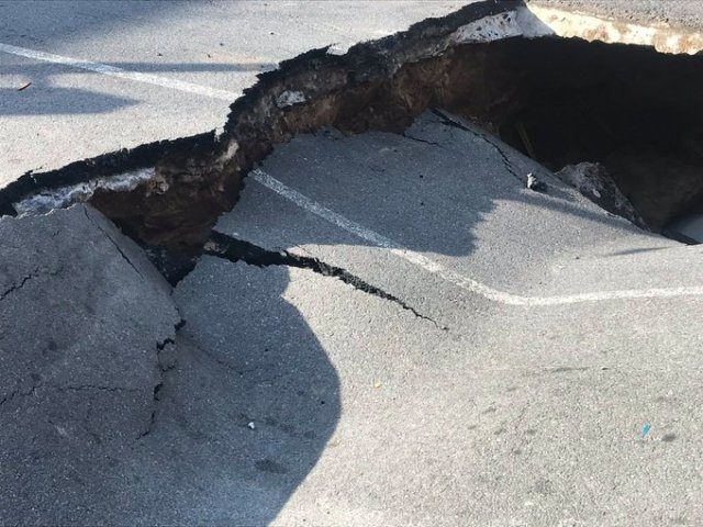 A sinkhole nearly swallowed a car Thursday in