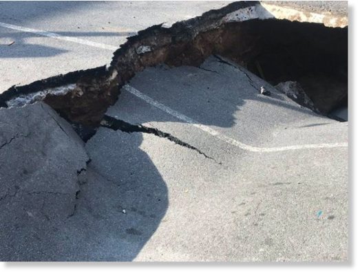 A sinkhole nearly swallowed a car Thursday in