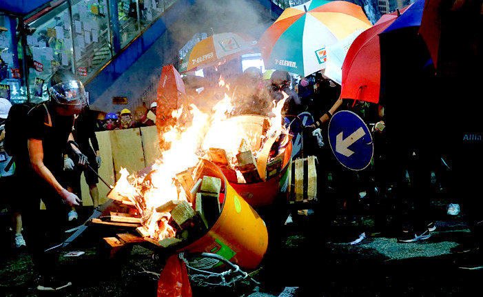 Demonstrators burn stuff