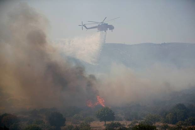 Tourists evacuated from camp as wildfire rages on Greek island