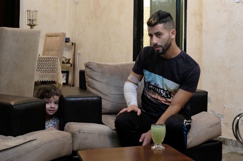 Click to enlarge Fadi Obeid, with his daughter