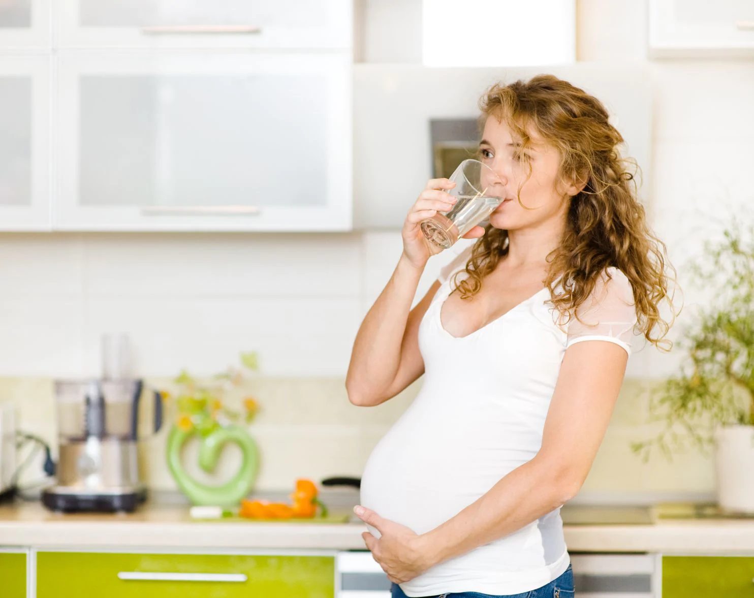 pregnant woman drinking water