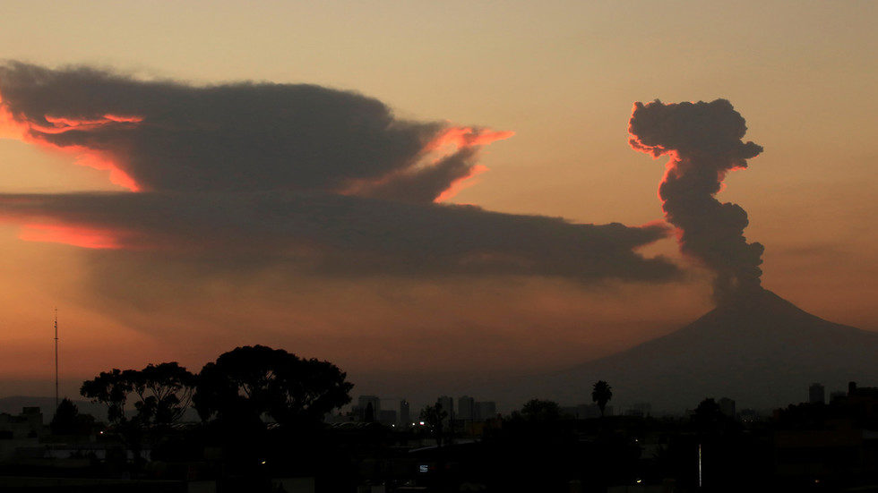 The Popocatepetl volcano spews a cloud of ash and steam