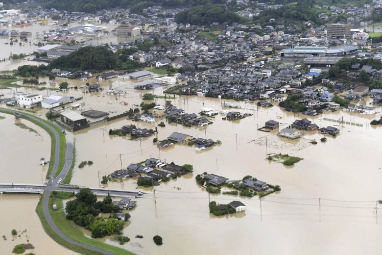 An aerial view shows submerged houses and facilities at a flooded area in Takeo, Saga prefecture, southern Japan, on Aug 28, 2019