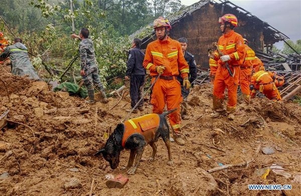 Rescuers search for missing people at a landslide site at Ma'an Village of Xiaohe Town in Qiaojia County, southwest China's Yunnan Province, Sept. 5, 2019.