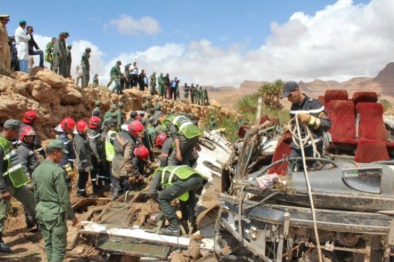 Click to enlarge Security forces search the wreckage of a flood-related bus accident in southern Morocco on September 8, 2019