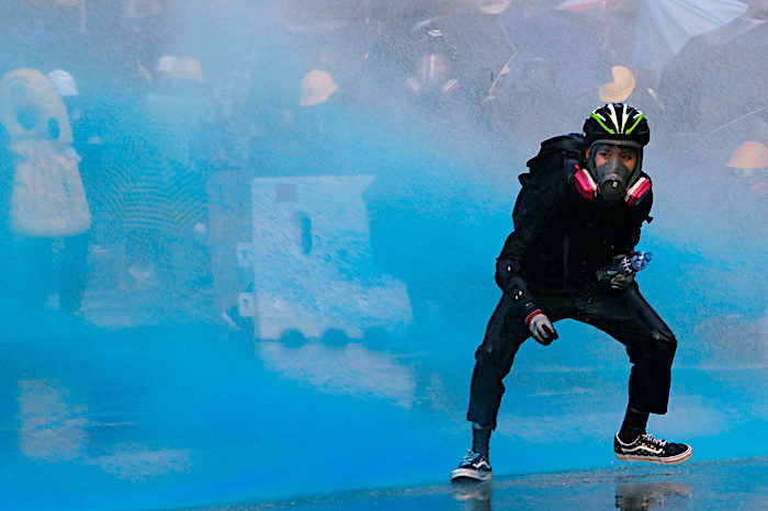 Click to enlarge Water cannons protester