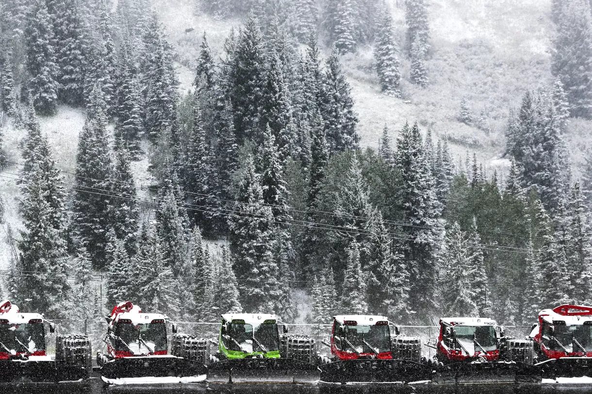 Fresh snow covers a line of snowcats at Alta in Little Cottonwood Canyon on Friday, Sept. 20, 2019.