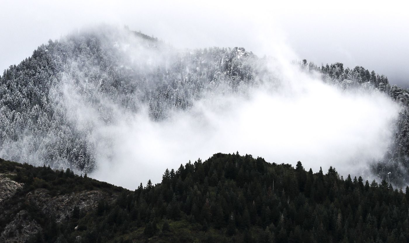 A blanket of fresh snow covers the mountaintops in Little Cottonwood Canyon in Salt Lake City on Friday, Sept. 20,