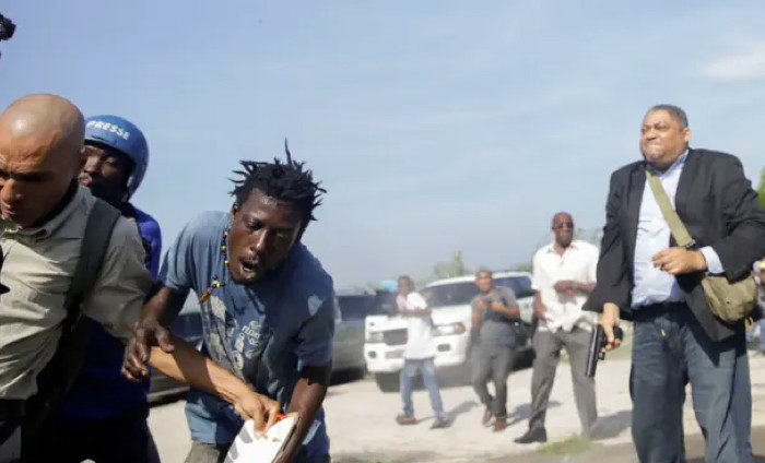 Click to enlarge Gunman Haiti