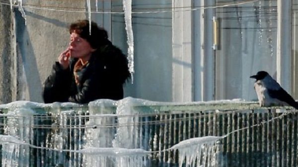 Russian woman smoking on balcony