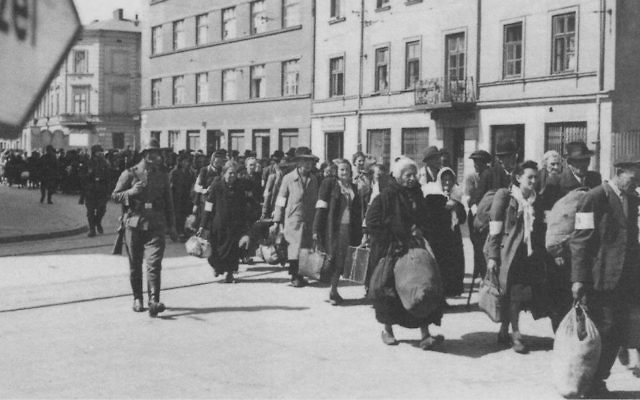 Jews are marched through the streets during the liquidation of the Krakow Ghetto, 1943