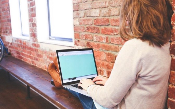 Click to enlarge woman using laptop
