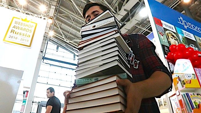 Click to enlarge man with books