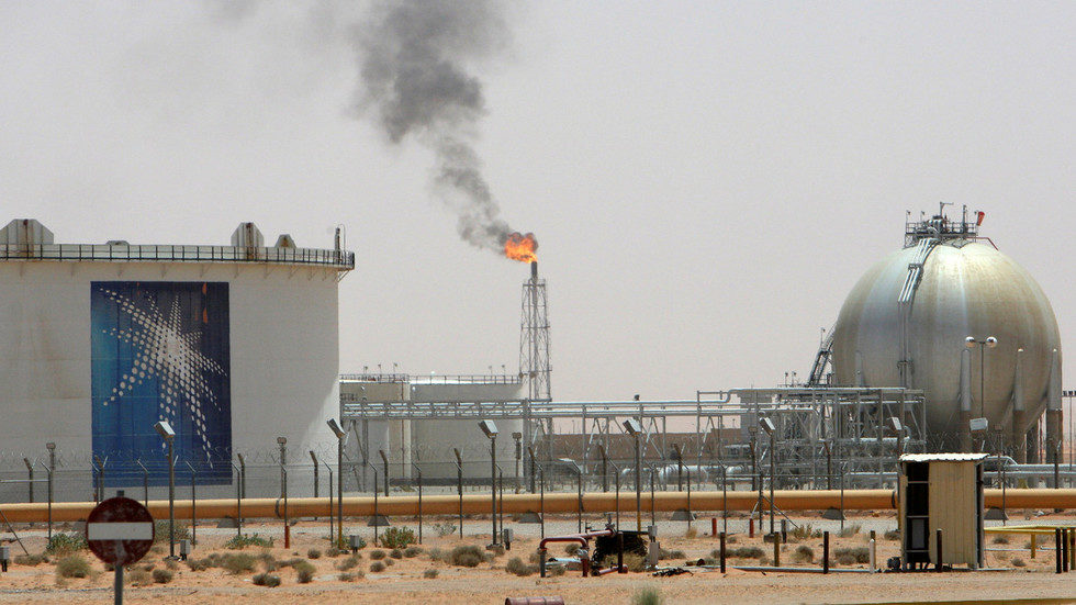A gas flame is seen in the desert near the Khurais oilfield, Saudi Arabia
