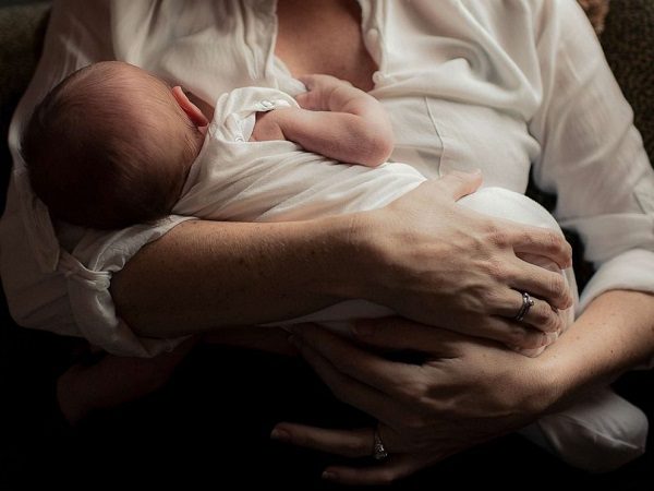 Mother and baby breastfeeding