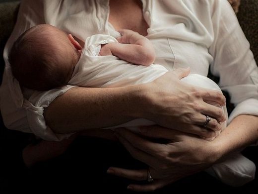 Mother and baby breastfeeding