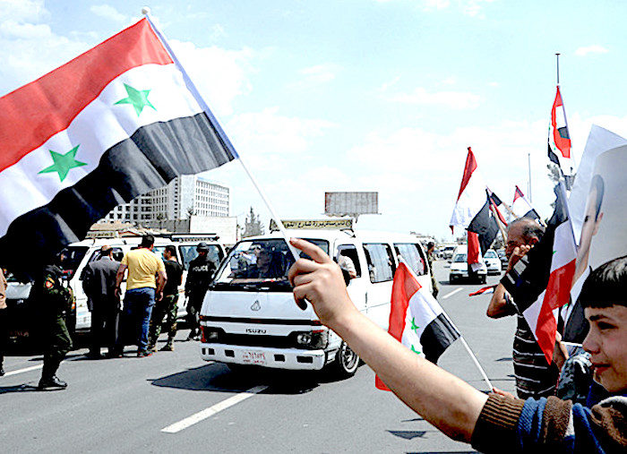 Click to enlarge SyriansFlagsRoad