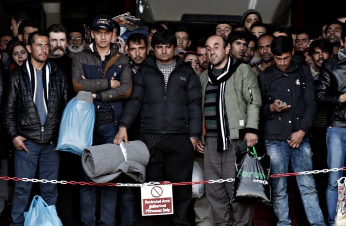 Click to enlarge Migrants arrive in Greece