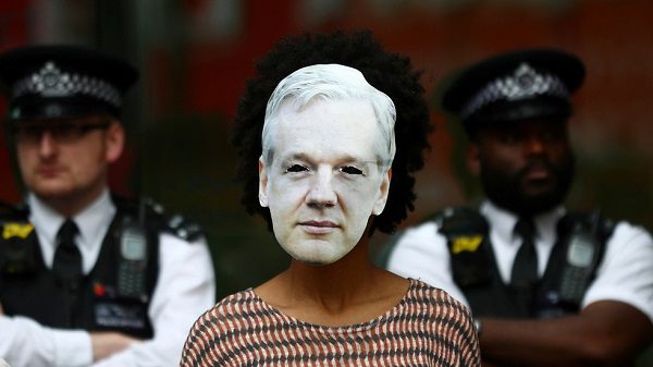 Click to enlarge Assange protester