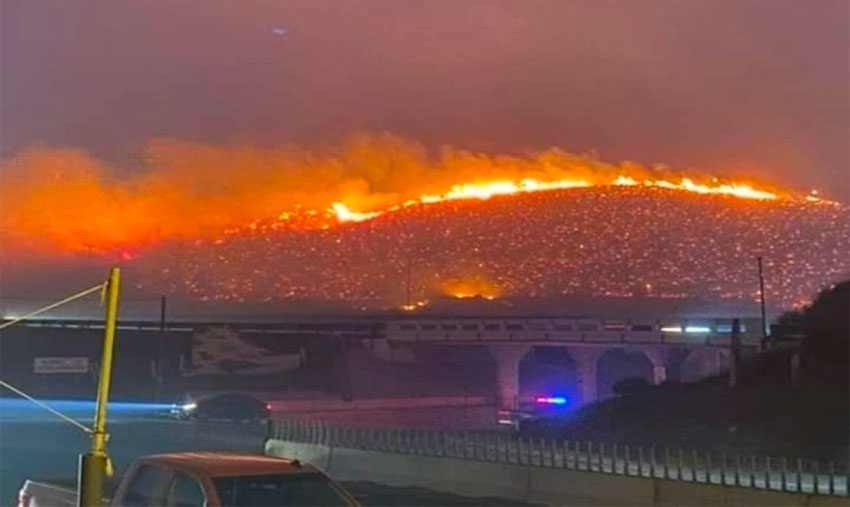 A wildfire burns yesterday in Tijuana