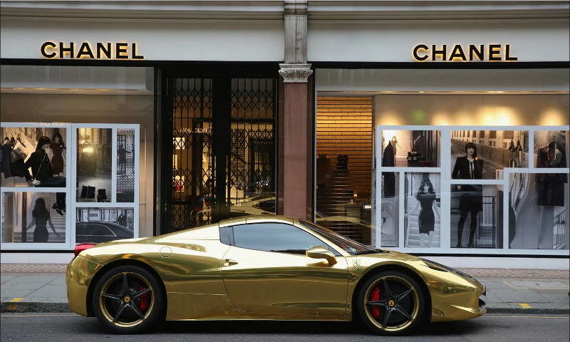 wealth one percent ferrari status symbol