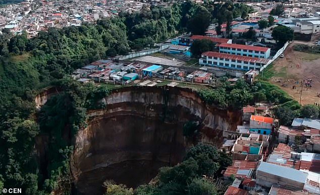 An image showing the aftermath of the landslide, which saw houses plummet down a cliff