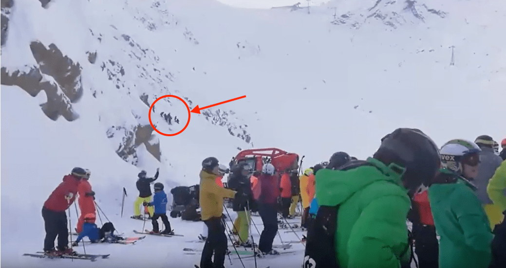 Rescuers can be seen on the slopes.