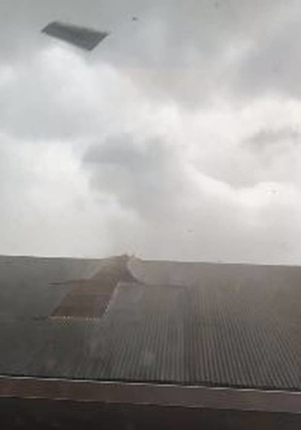 Click to enlarge Footage of the tornado hitting the roof was posted on Twitter.