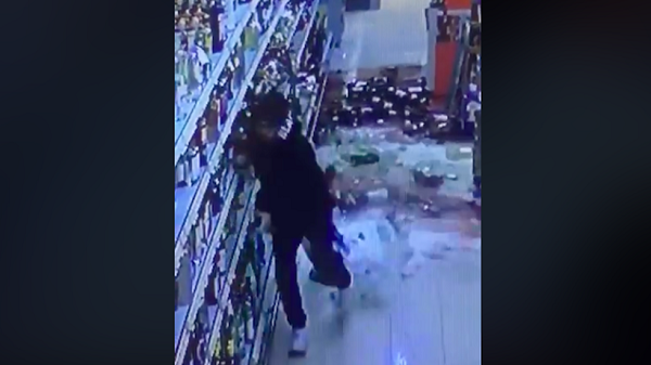 Man breaking bottles