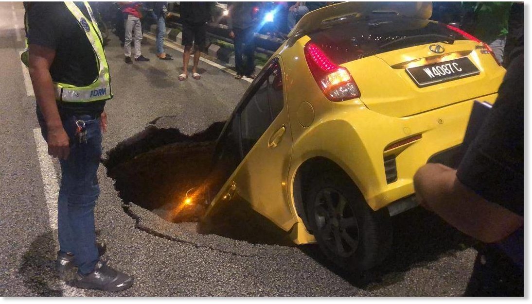 Woman in car swallowed by sinkhole in Kuala Lumpur 