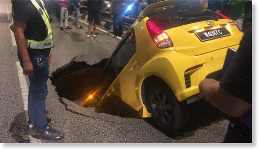 A Myvi was swallowed by a sinkhole in the heart of Kuala Lumpur on Nov 25