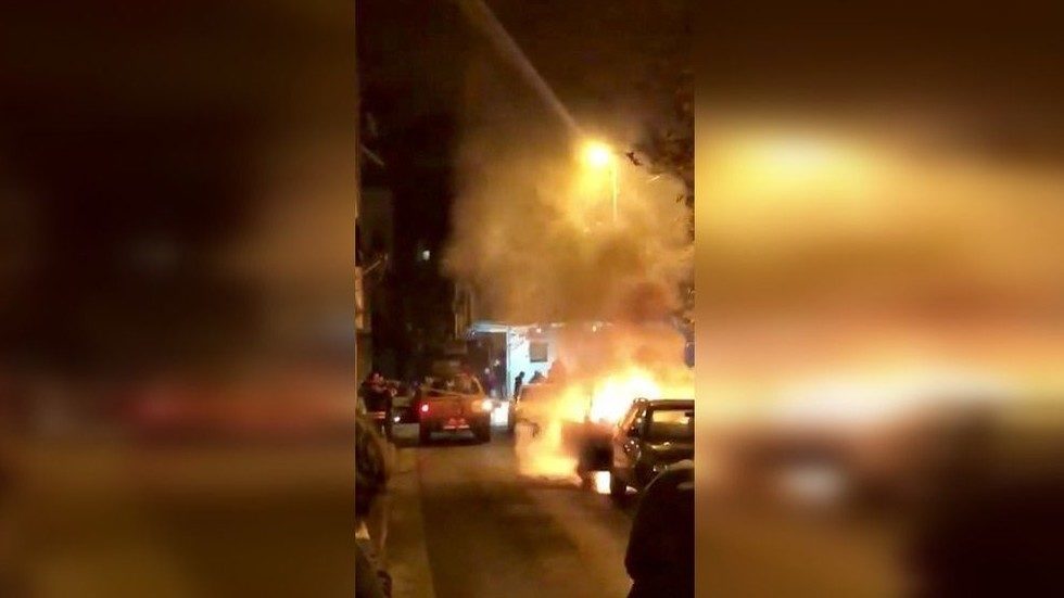 Click to enlarge A car is seen on fire after a car alarm short-circuited following a strong earthquake in Tirana, Albania, November 26, 2019