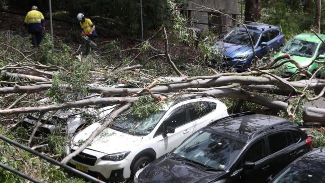 Click to enlarge Damaged cars in Dumaresq Street in Gordon.