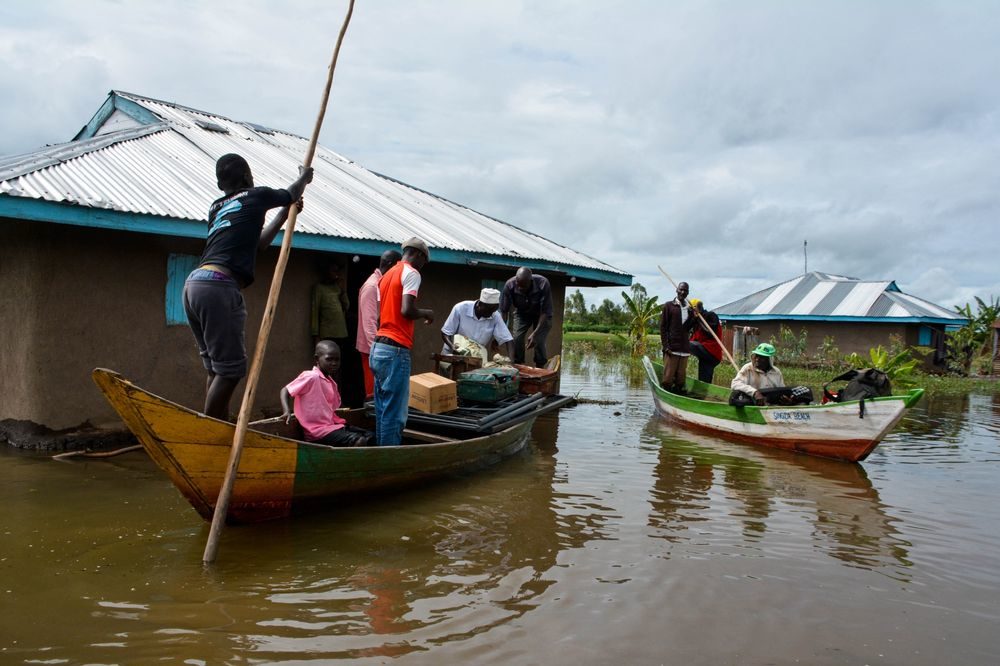 Families are evacuated after their houses were flooded in Kisumu, Kenya