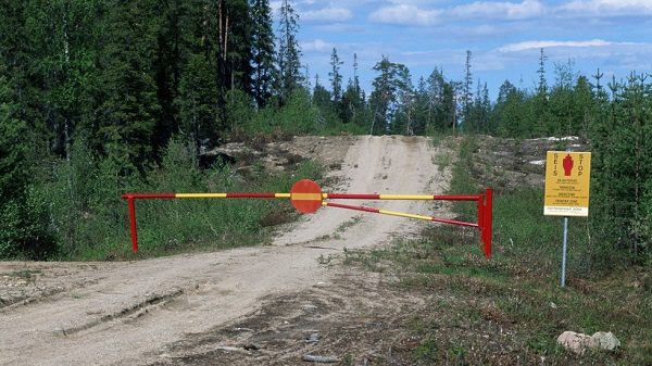 Barrier and a warning sign