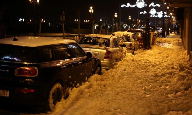 Sea foam covers the streets in Bayona, Galicia.