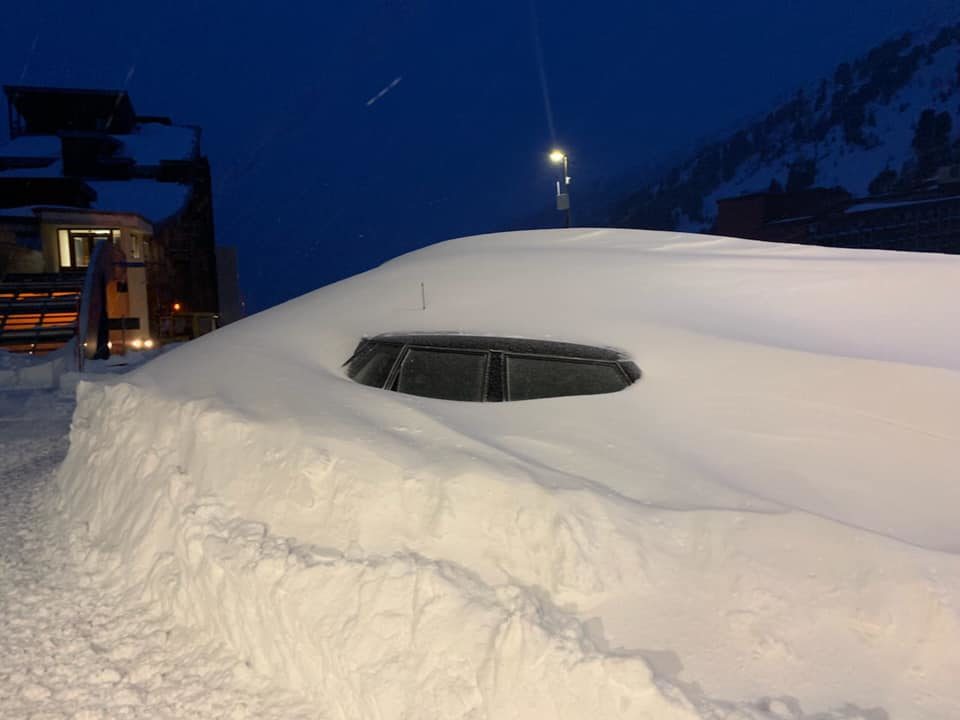 car buried by snow
