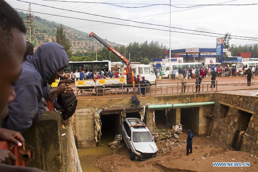 A tow truck rescues a vehicle after heavy rains in Kigali, Rwanda, Dec. 26, 2019. Heavy rains that hit Rwanda on Wednesday night killed at least 12 people