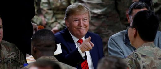 U.S. President Donald Trump eats dinner with U.S. troops at a Thanksgiving dinner event during a surprise visit at Bagram Air Base in Afghanistan, Nov. 28, 2019