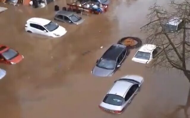 Cars submerged on a Jaffa street after central Israel is battered by downpour, January 4, 2020