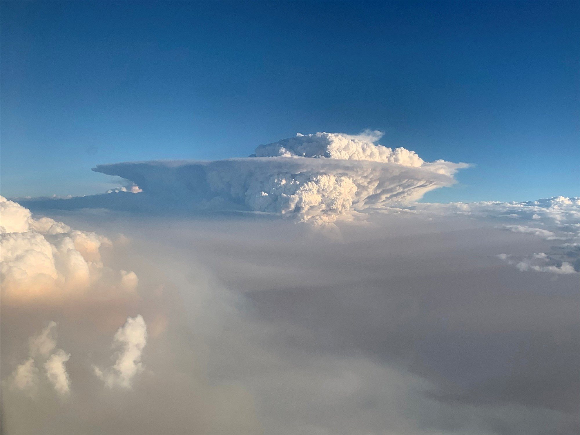 A pyrocumulonimbus cloud formation is seen from a plane as bush fires continue in New South Wales, Australia, on Jan. 4, 2020