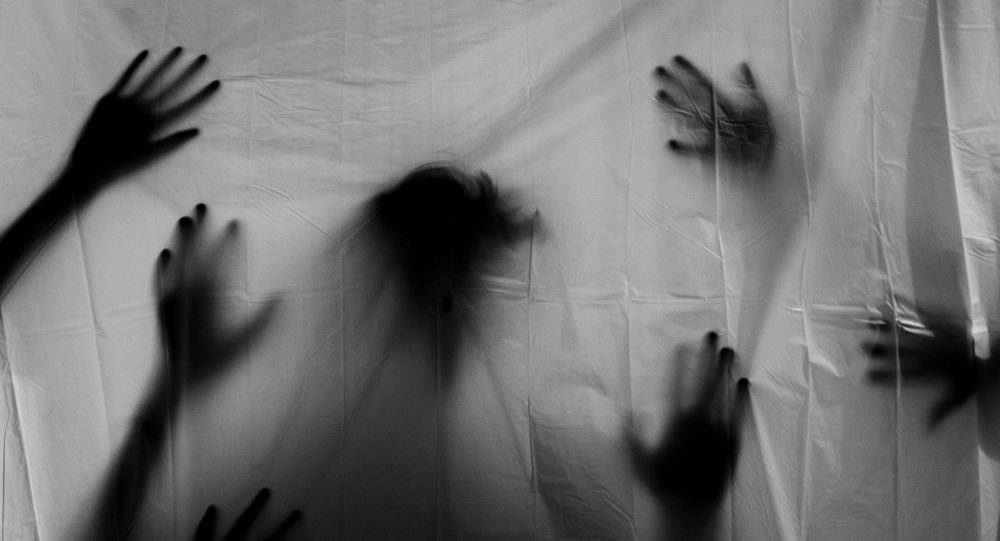 Click to enlarge hands behind sheet