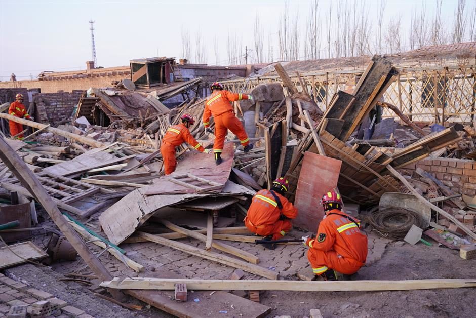 Rescuers check for safety hazards in Jiashi County in Kashgar Prefecture, Xinjiang Uygur Autonomous Region, on Monday.