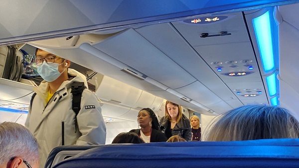 Click to enlarge Passenger wearing a mask