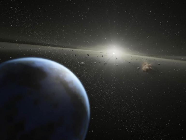 This artist's animation illustrates a massive asteroid belt in orbit around a star the same age and size as our Sun.