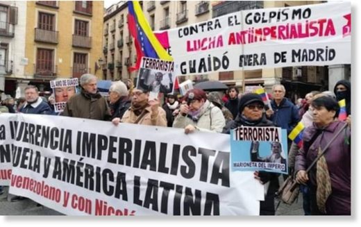 Protesters greet Guaido in Spain
